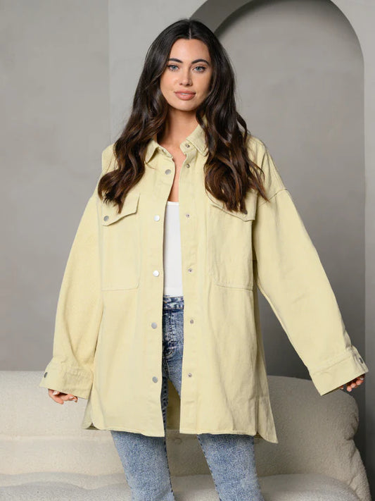 button up collar and front pocket provide sleek jacket in cream.