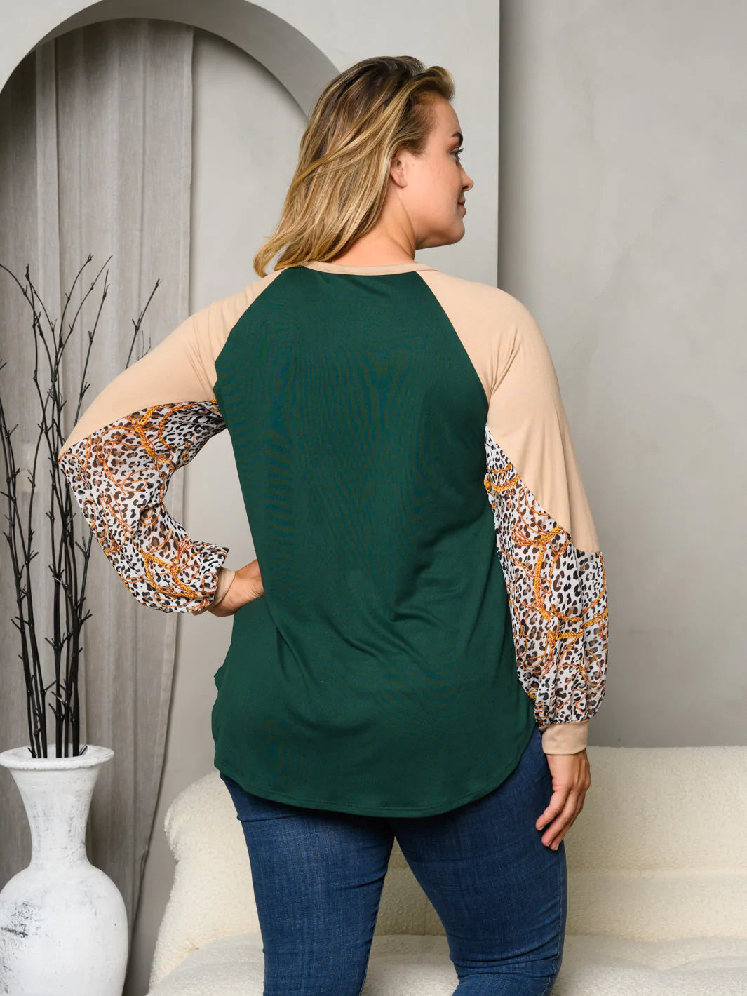 Back side view with animal print sleeves.