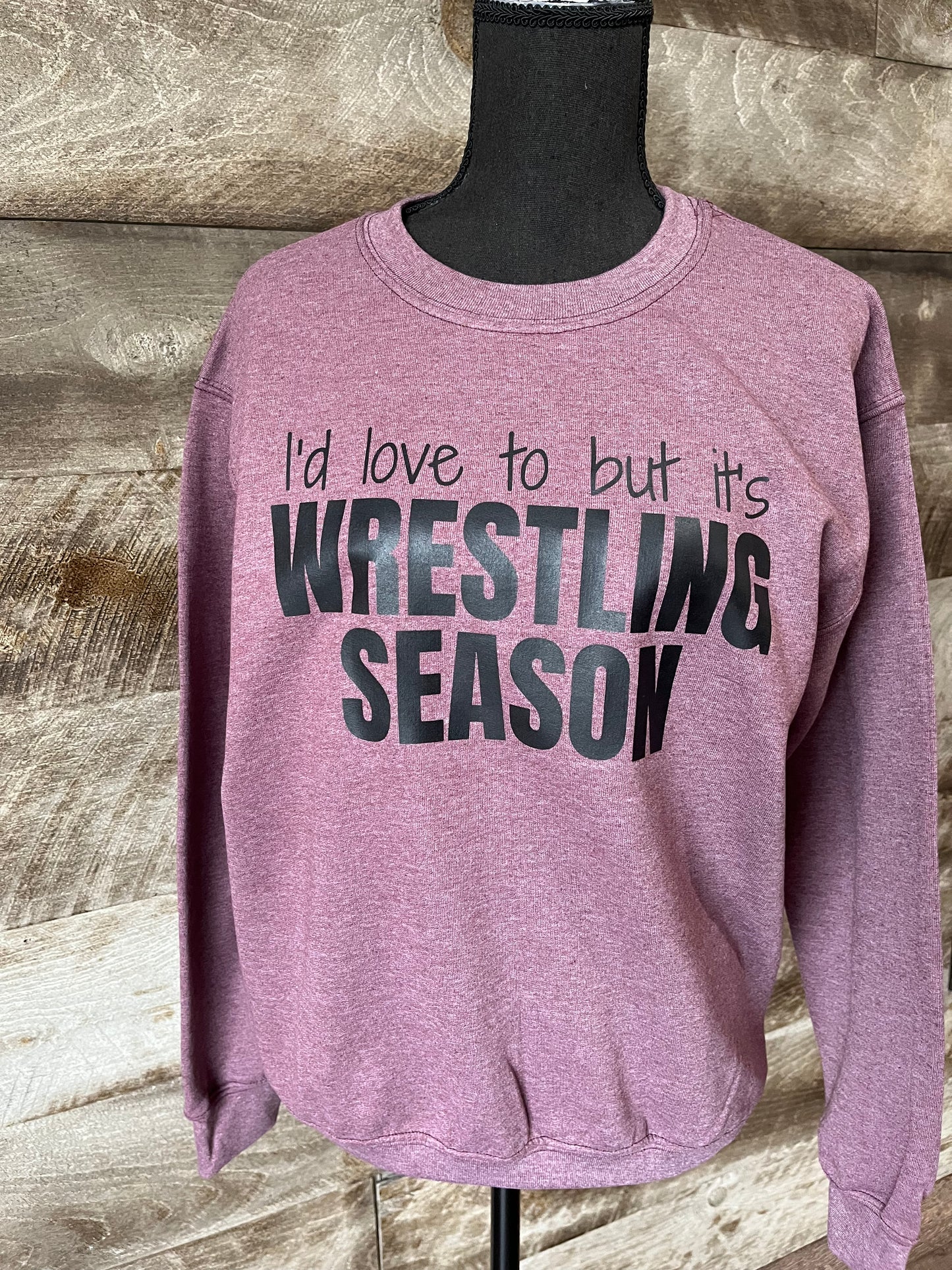 Adult Crew Sweatshirt with the words I'd love to but it's WRESTLING SEASON on the front.