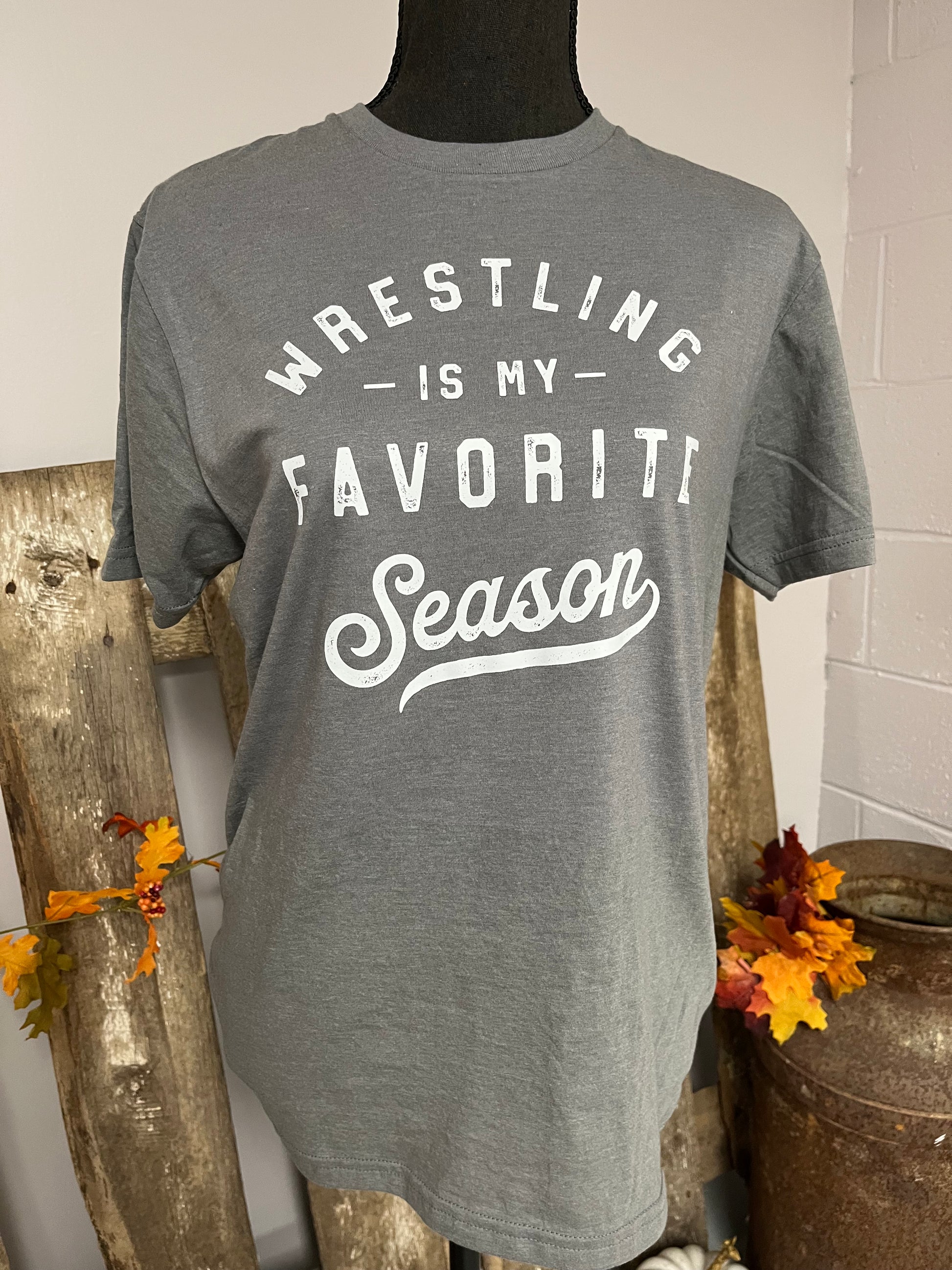 Adult Tee with the words Wrestling is my favorite season on the front.