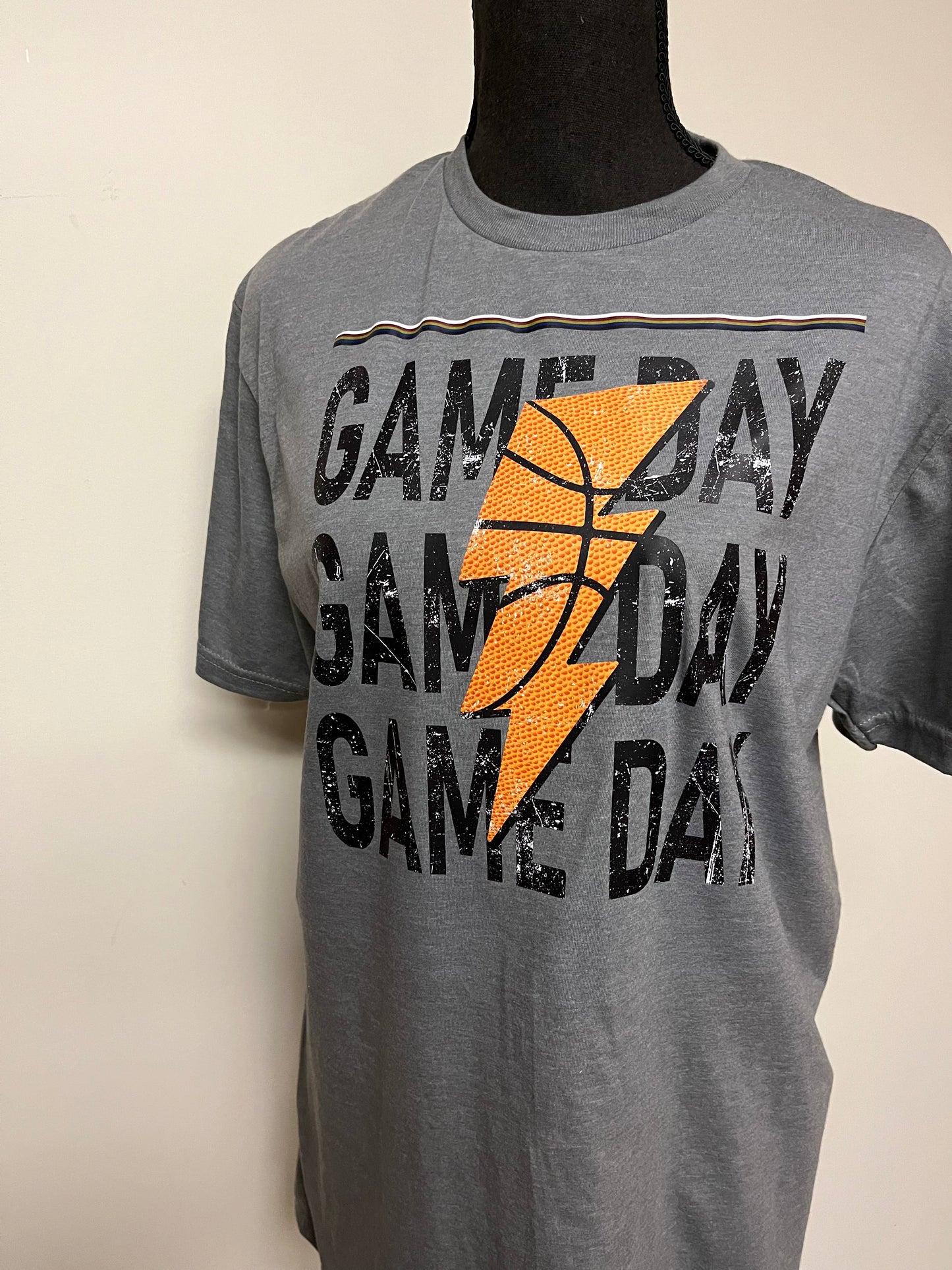 Adult Tee with the words GAME DAY on the front with a Lighting Bolt. Basketball print. Front view.