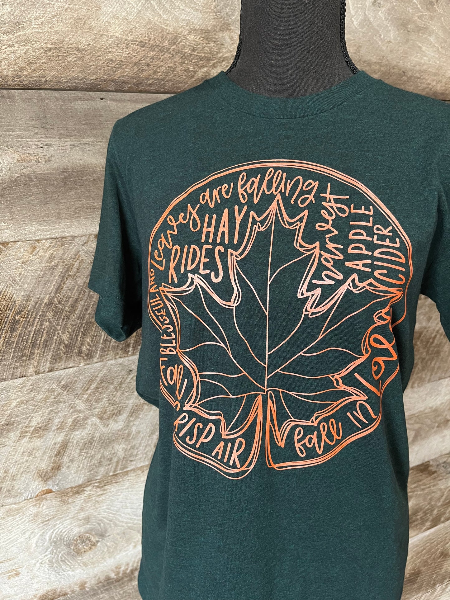 Adult Tee with Large leaf and writing about Fall on the front.