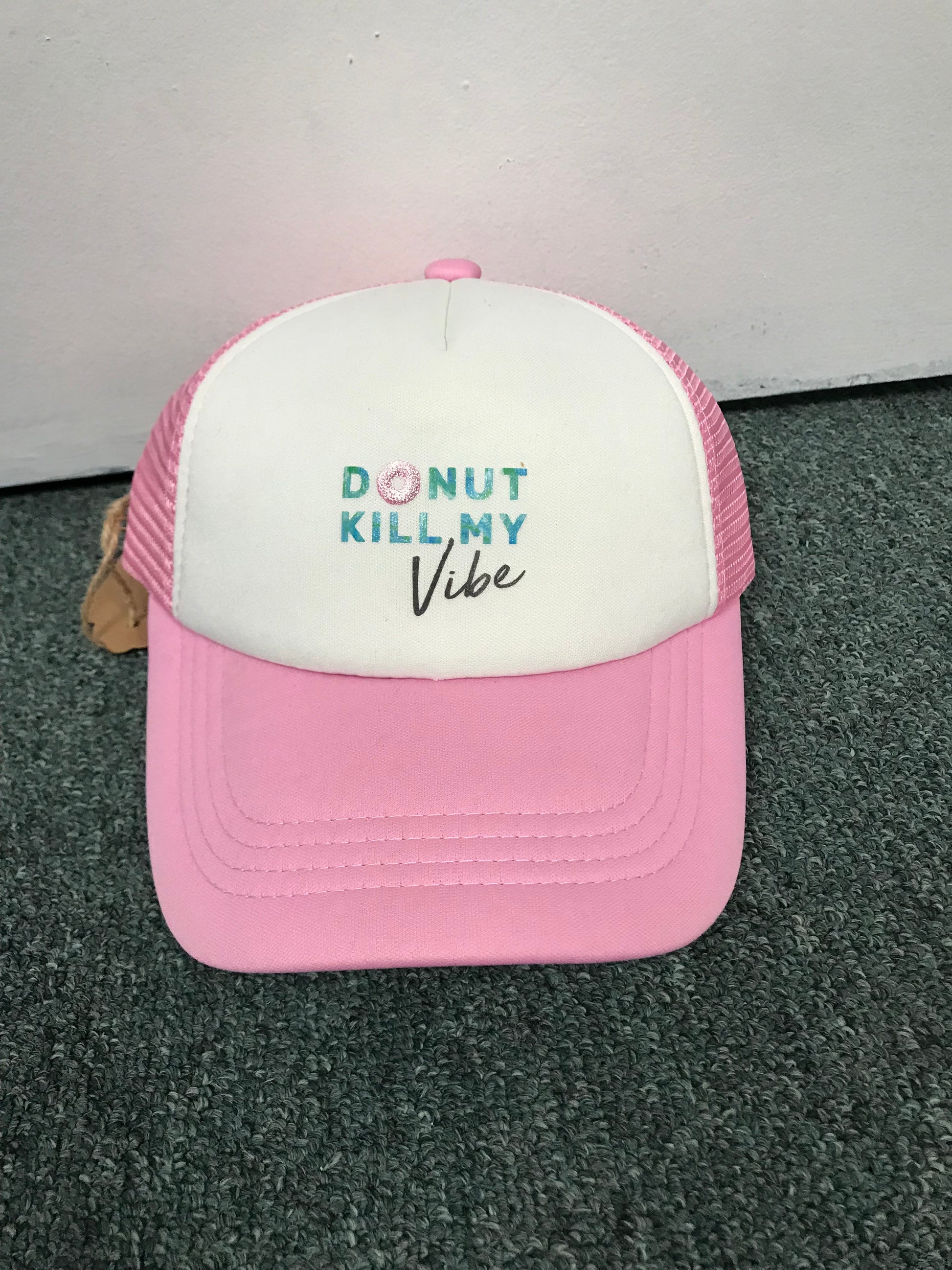 Childs hat pink and white with the words Donut Kill My VIbe on it.