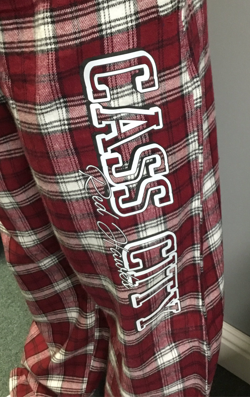 Cass City Red Hawks Flannel Pants with the words Cass City down the leg-close up.