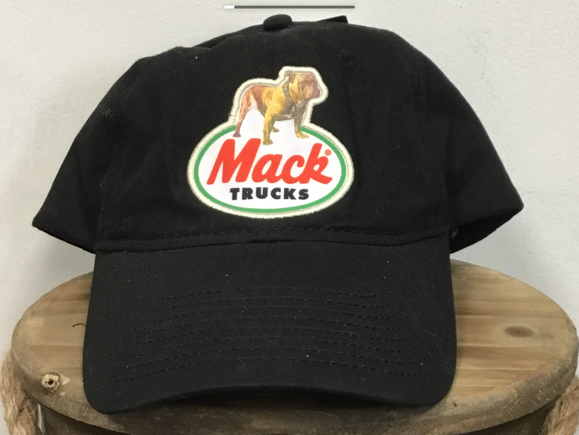 Black hat with Logo Mack Trucks on it.